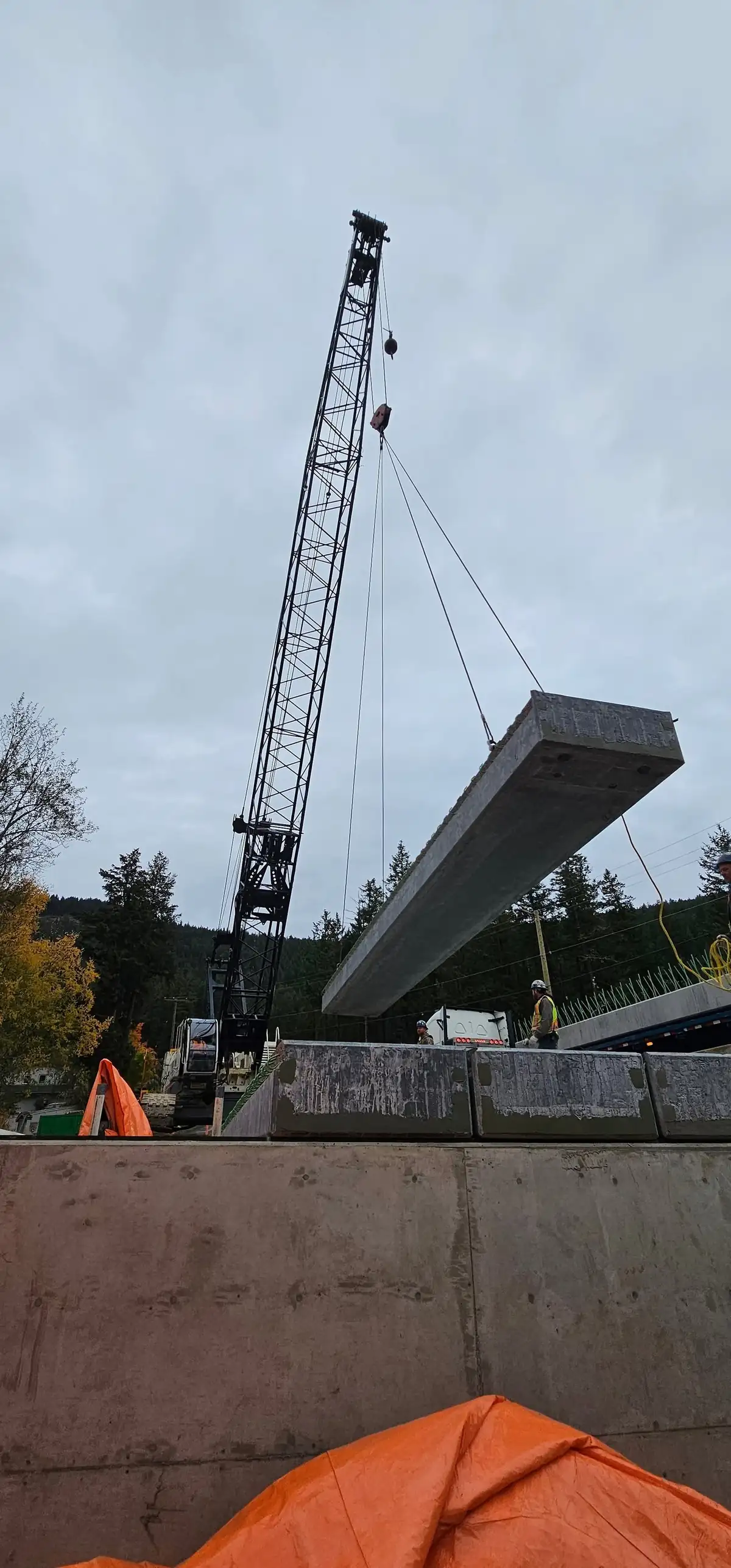 Precast girder being lifted into place