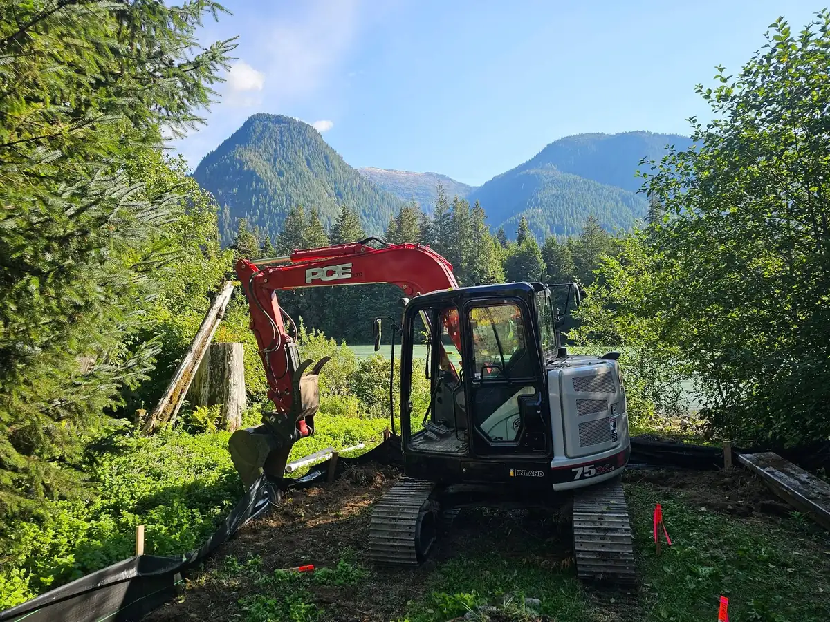 Compact PCE excavator at a coastal work site