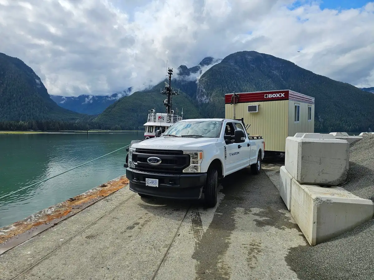 Pickup and site office trailer at the landing beside the inlet