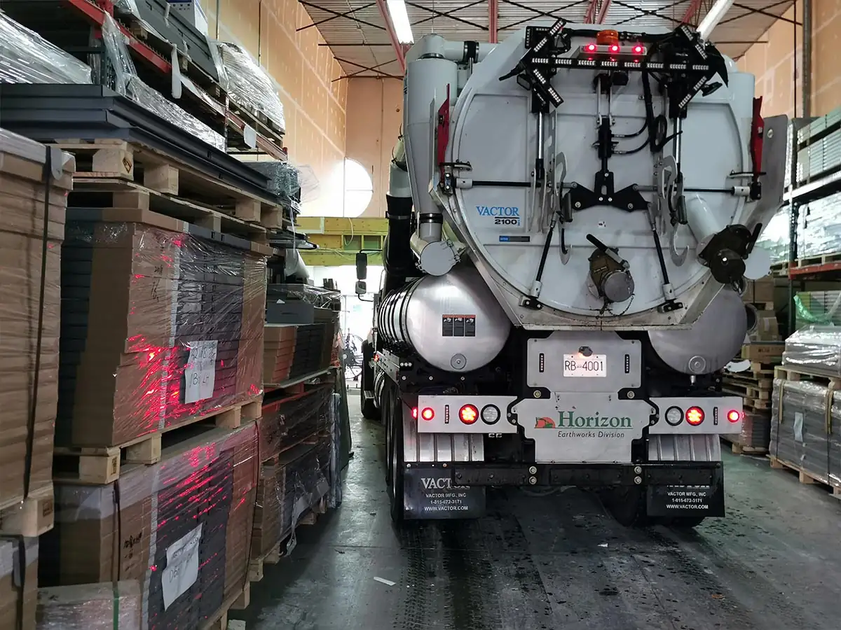 Vacuum truck parked inside the warehouse bay